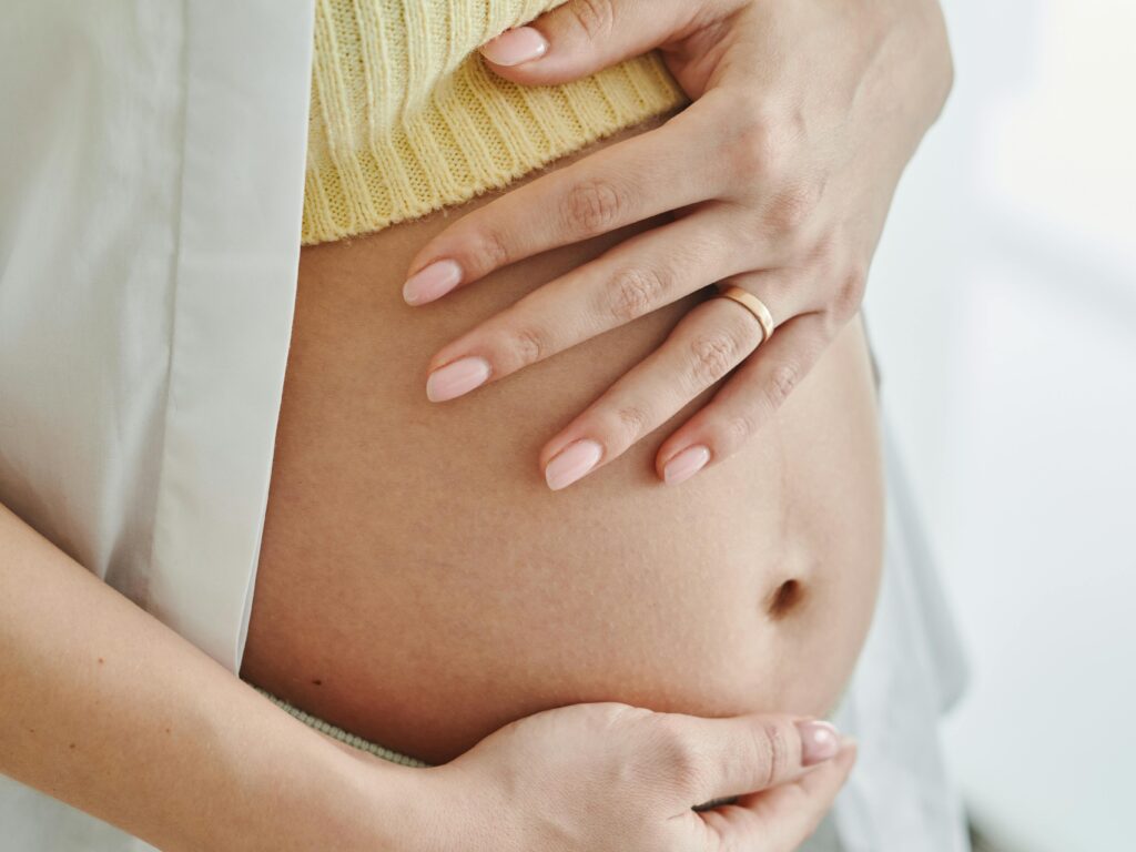pregnancy Pregnant woman holding her belly